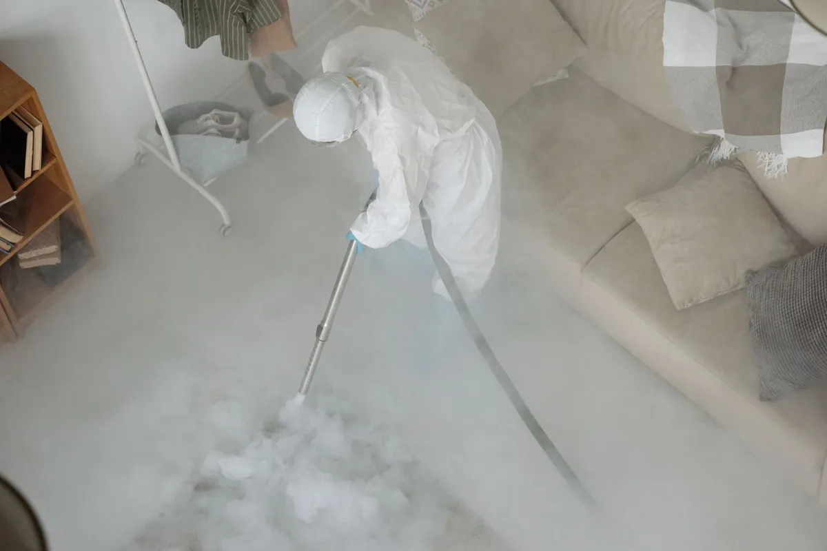 Biohazard cleanup technician in protective equipment, Holland, MA
